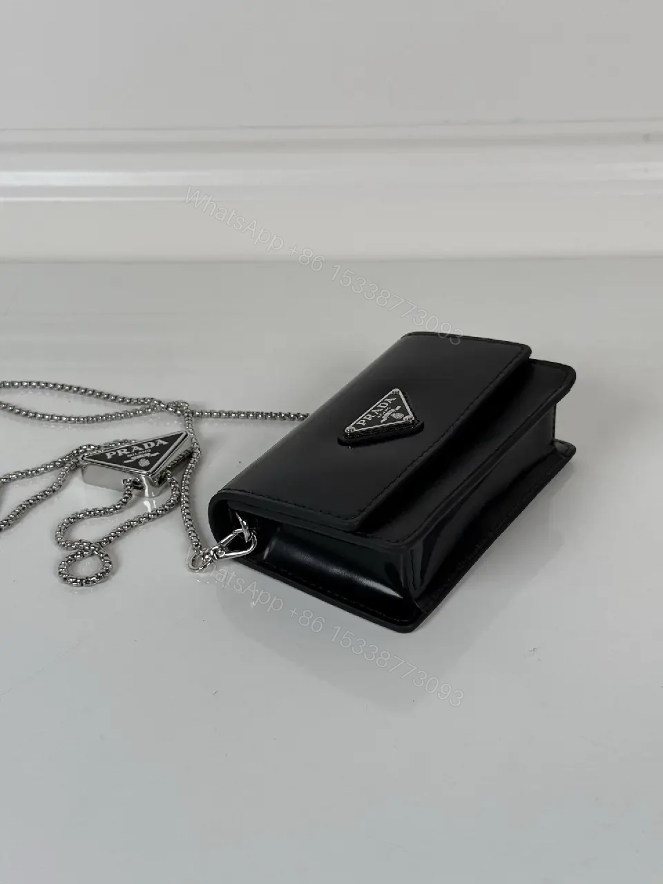 View 6 of Chic Black Leather Mini Bag with Signature Logo Chain