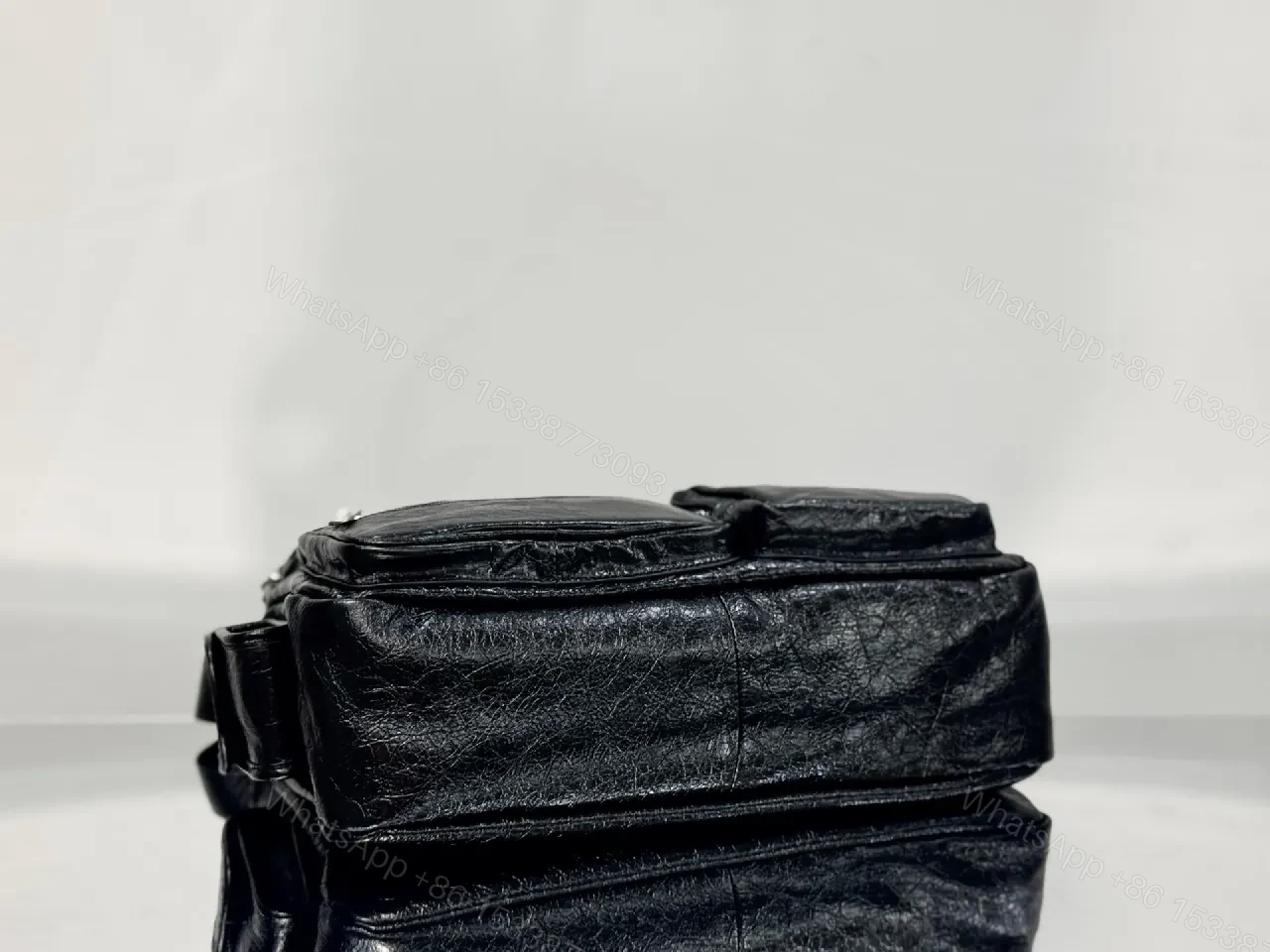 View 3 of Compact Black Leather Messenger Bag: Sleek Crossbody Utility