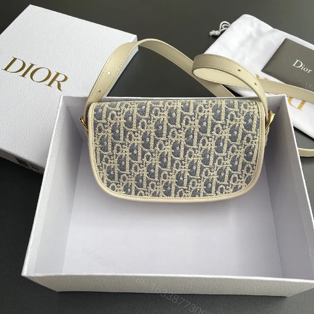 View 8 of Cream Leather-Trim Monogram Crossbody with Gold Turn-Lock, Compact Style