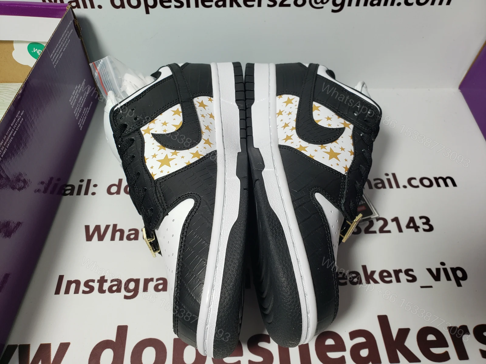 View 2 of Supreme x Nike SB Dunk Low Black Stars DH3228-102