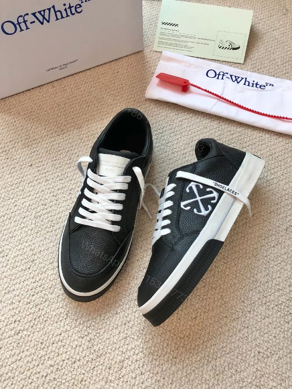 View 9 of Low-Top Black Pebbled Leather Sneakers with Signature Detailing