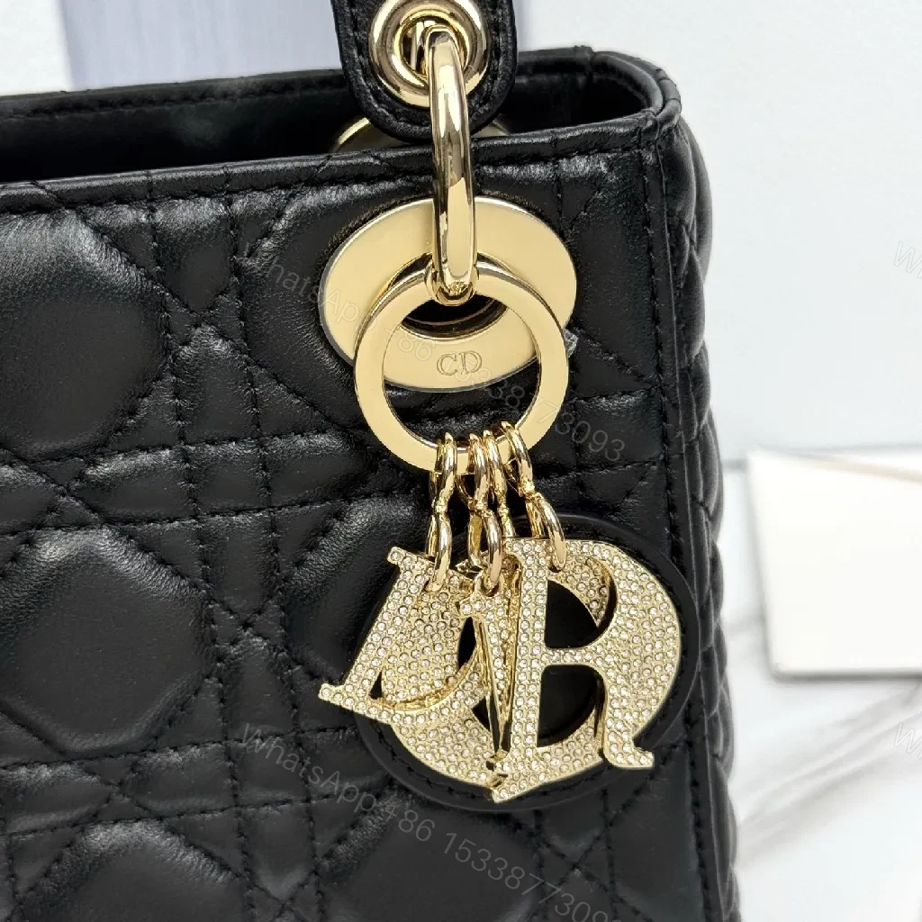 View 5 of Small Black Quilted Mini Bag with Gold Hardware - Elegant Compact Crossbody