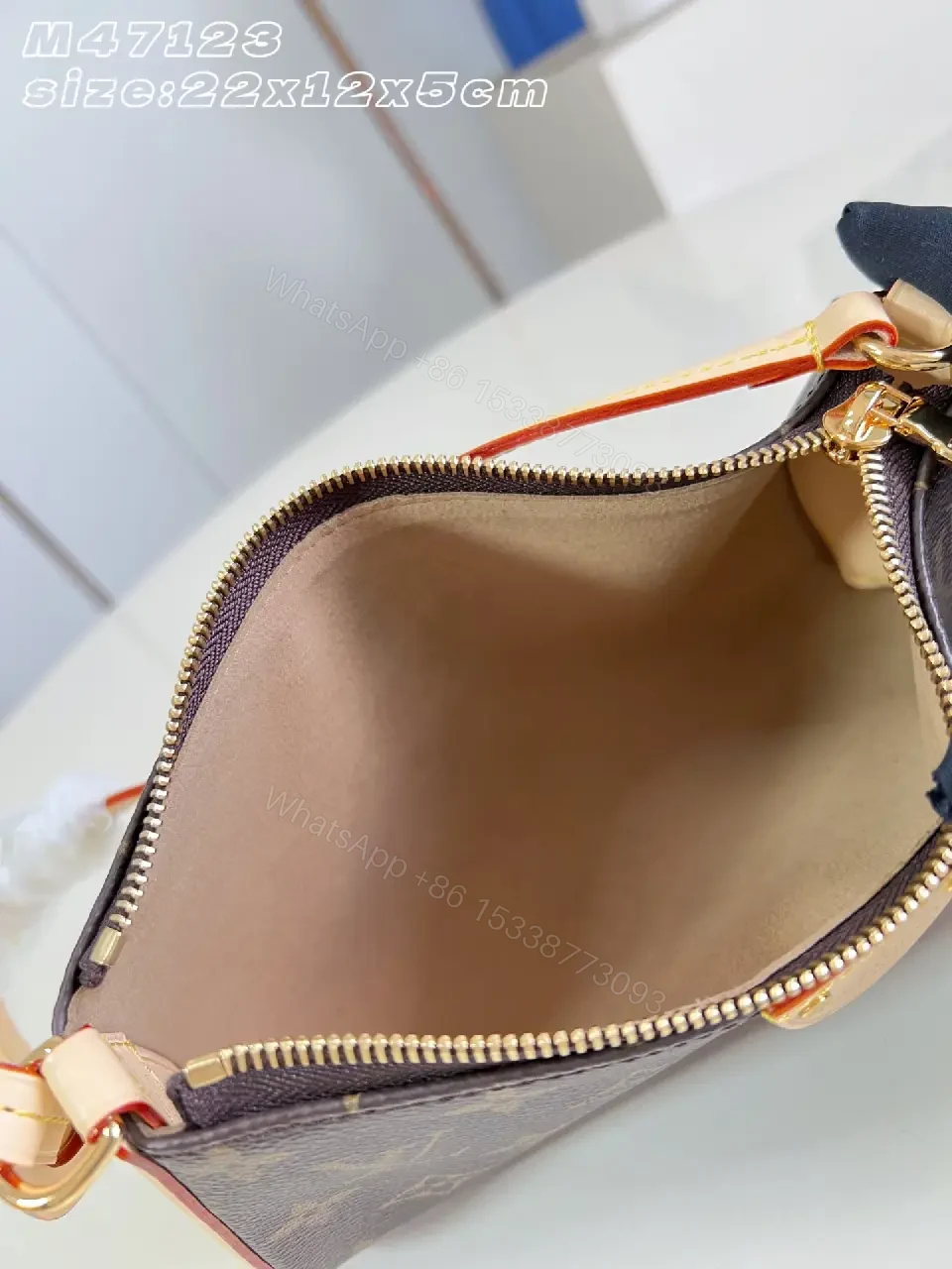 View 2 of Dark Brown LV Monogram Leather Clutch with Red Piping