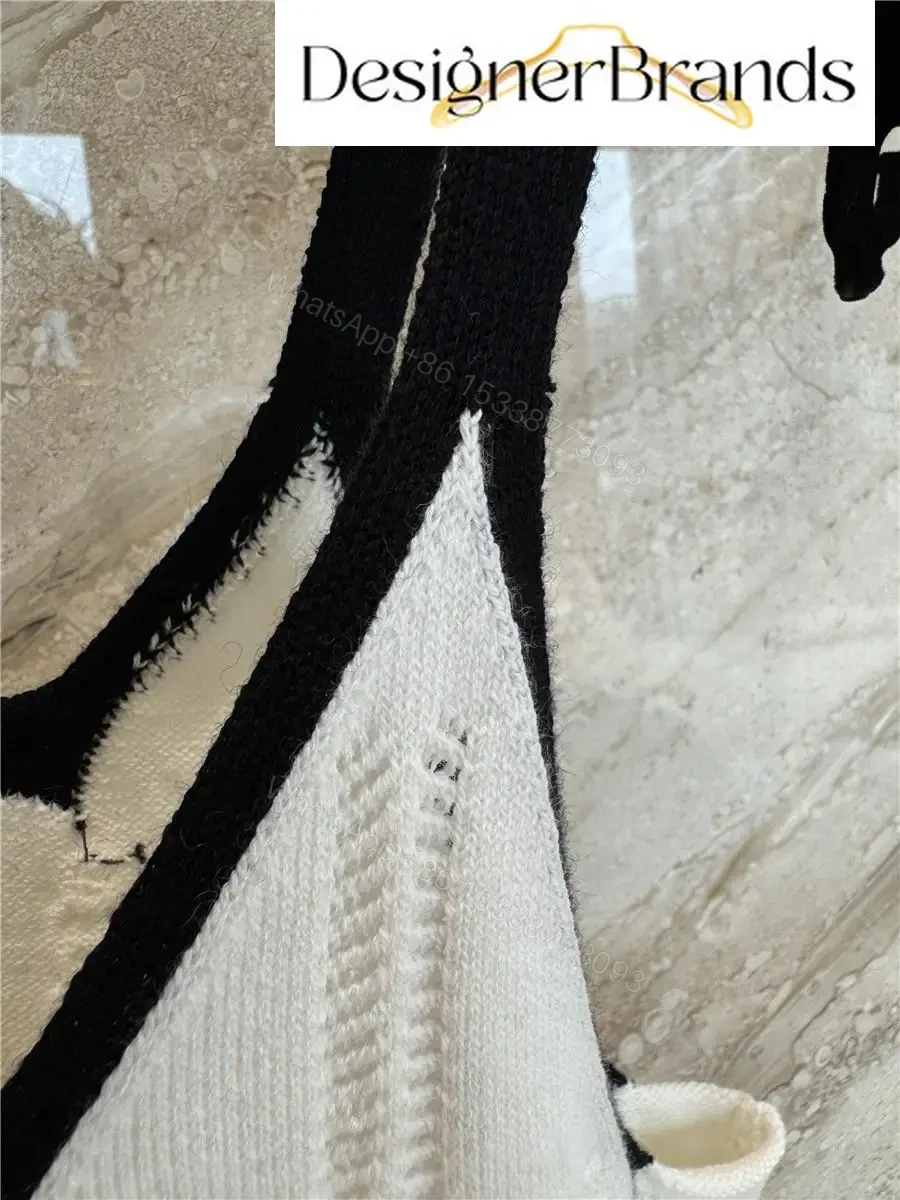 View 9 of White Knit Tank: Black Trim, Vertical Rib, Sleek Silhouette, Sleeveless Top