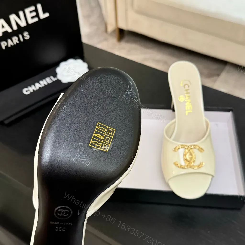View 7 of White Patent Mules with Gold Logo Embellishment – Sleek Luxury Footwear