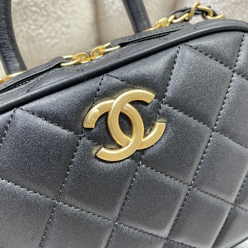 View 4 of Compact Black Quilted Handbag with Gold Logo Chain