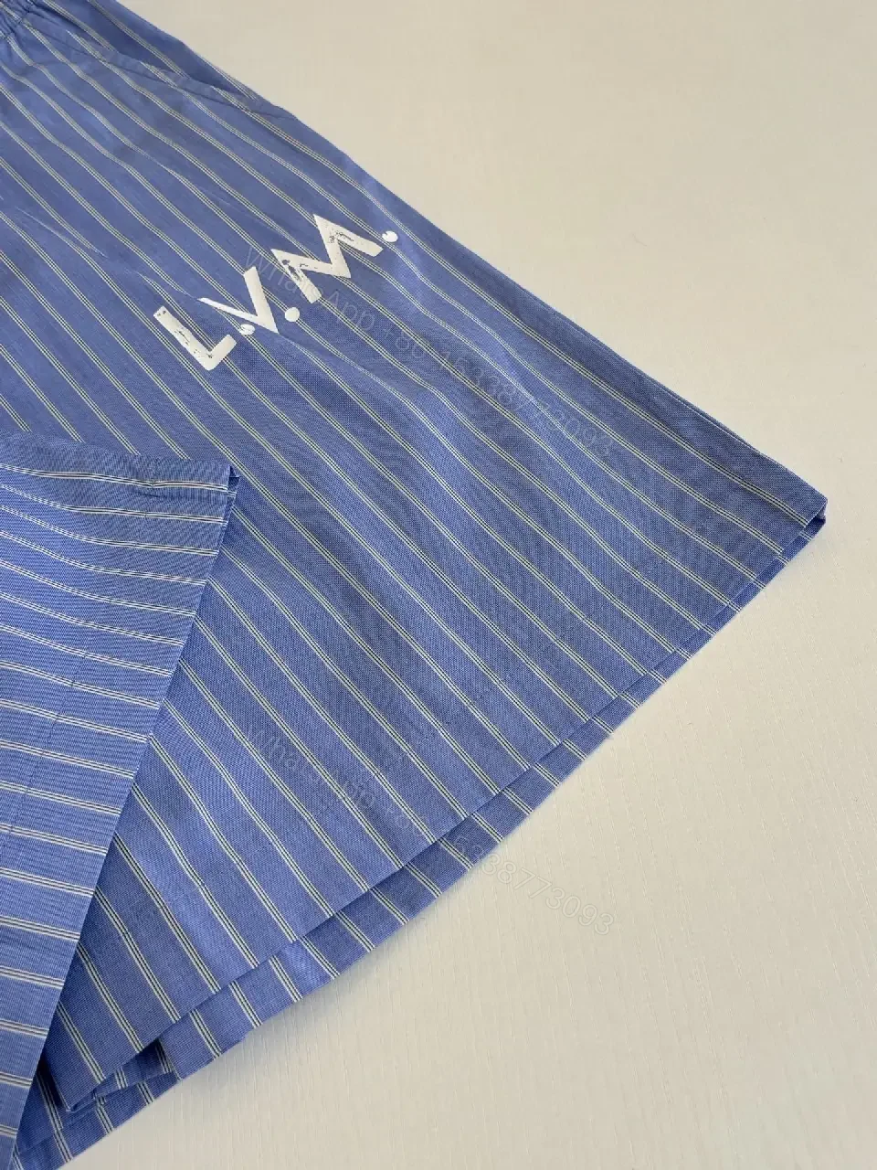 View 12 of Blue Striped Lightweight Drawstring Shorts - Subtle Embossed Logo Luxury