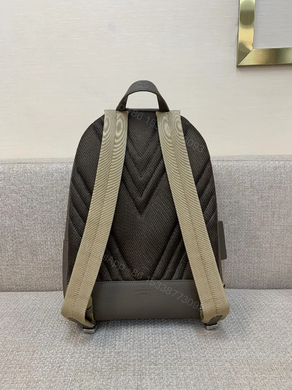 View 3 of Structured Minimalist Leather Backpack with Subtle LV Motif
