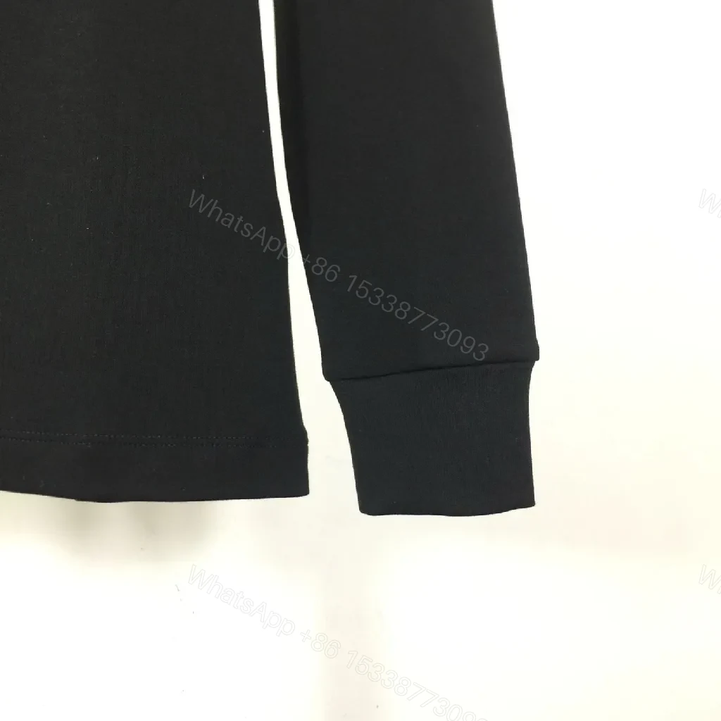 View 6 of Minimalist Black Sweatshirt with Subtle Monogram Accent