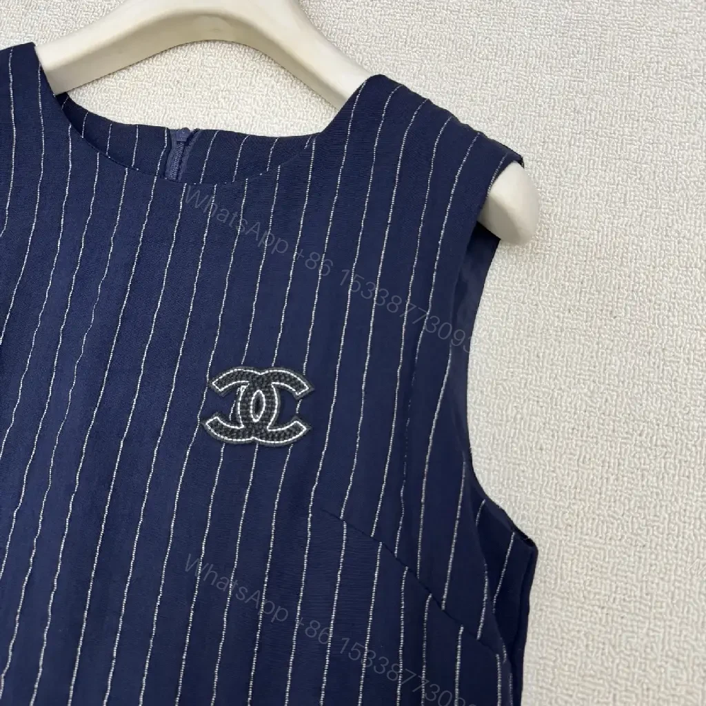 View 11 of Navy Pinstripe Cotton A-Line Dress with Chanel Logo Key Feature