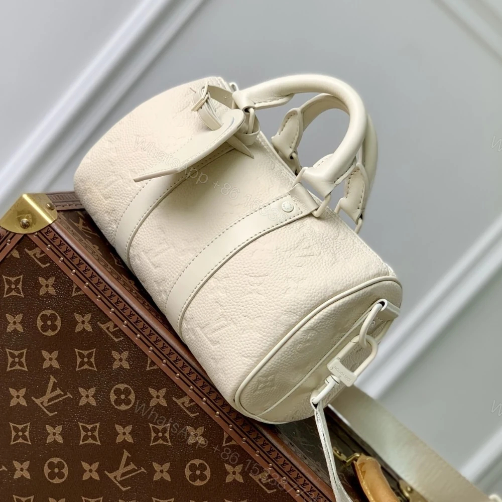 View 2 of Louis Vuitton Keepall Bandoulière 25 Bag Cream 25Cm M24434