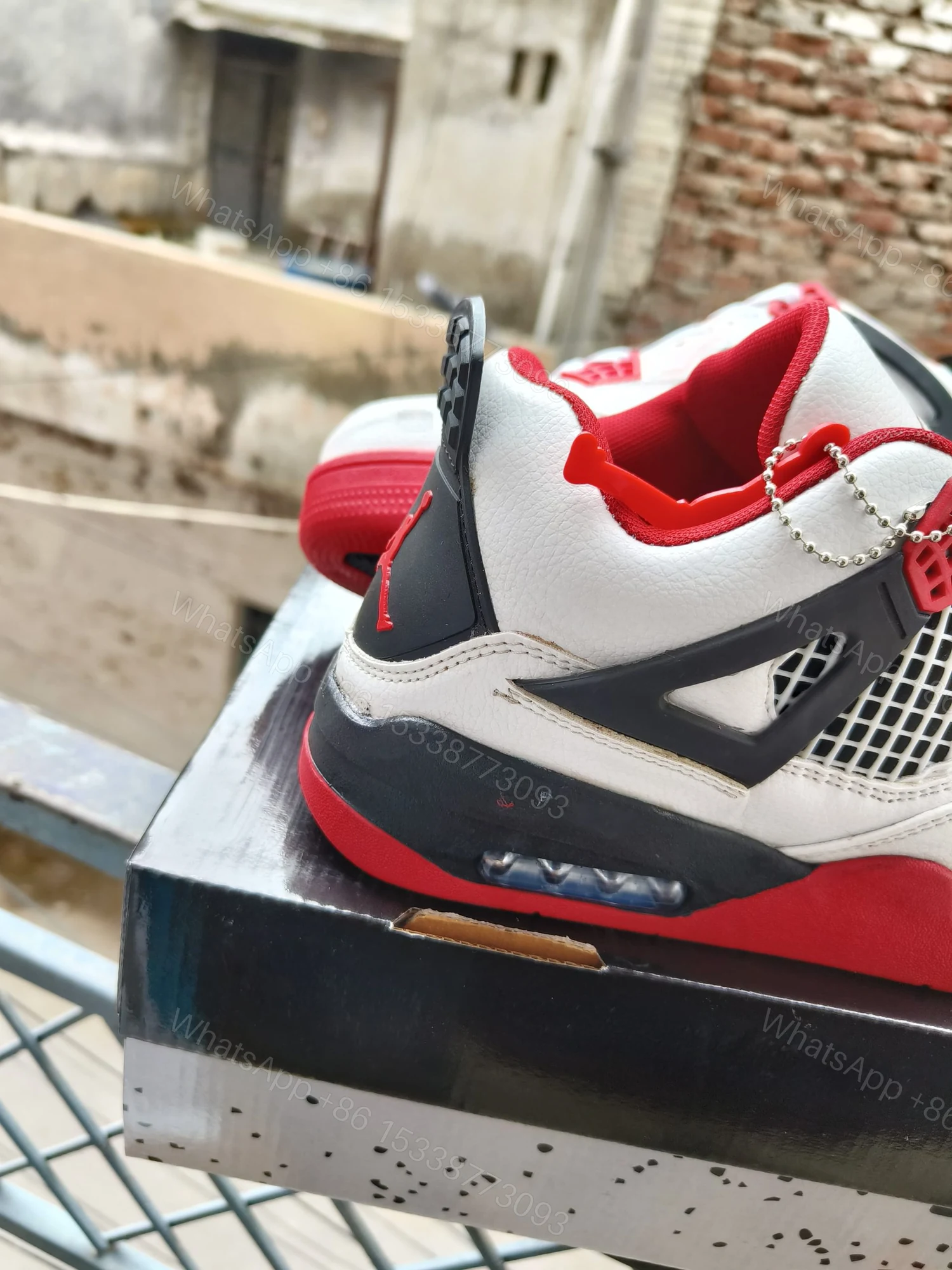 View 4 of BUY FIRST COPY NIKE JORDAN 4 “RED/WHITE” SNEAKERS