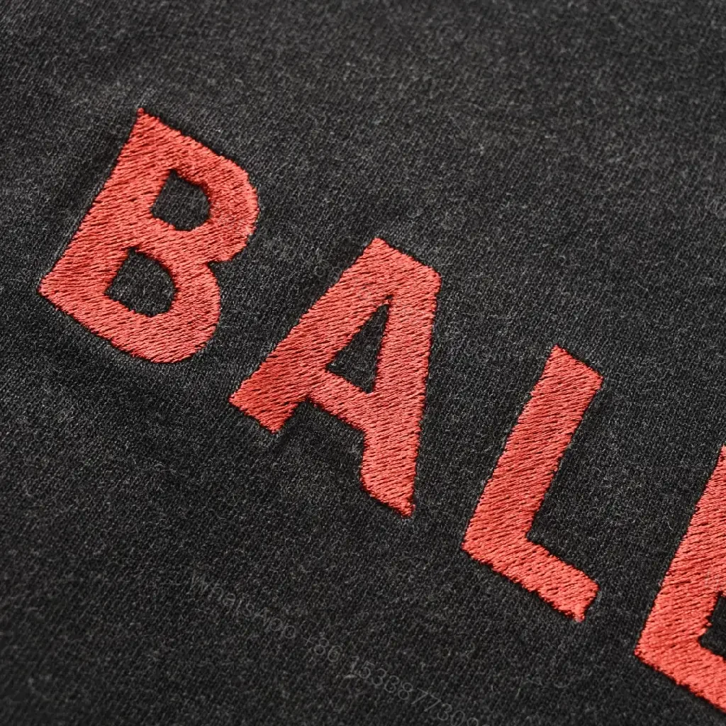 View 11 of Minimalist Black Cotton Tee with Subtle Red Embroidery