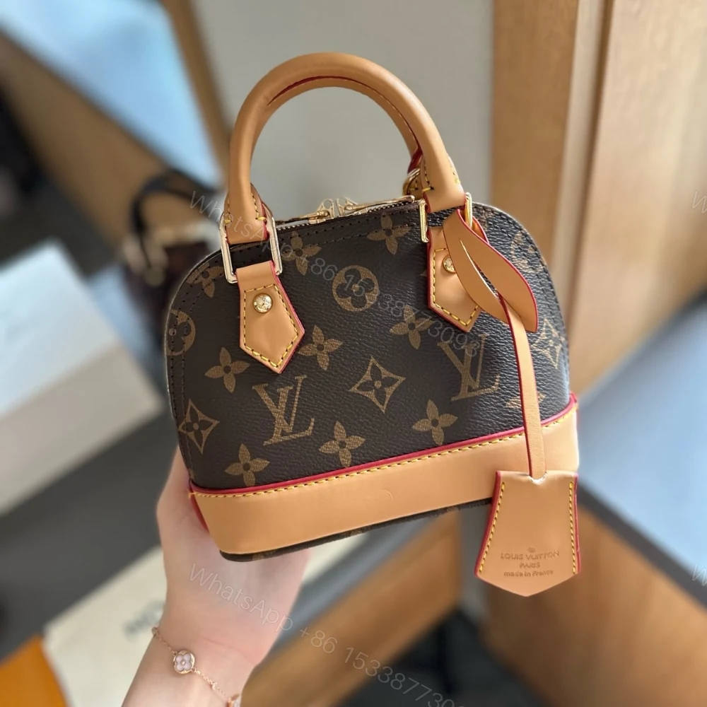 View 2 of Louis Vuitton Alma Nano Bag Monogram Brown 18Cm M82717