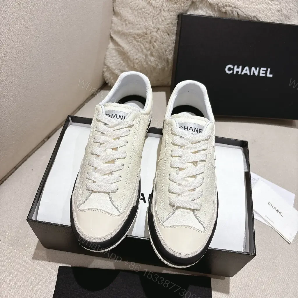 View 7 of Cream Leather-Texture Sneaker with Signature Emblem, Modern Couture Style