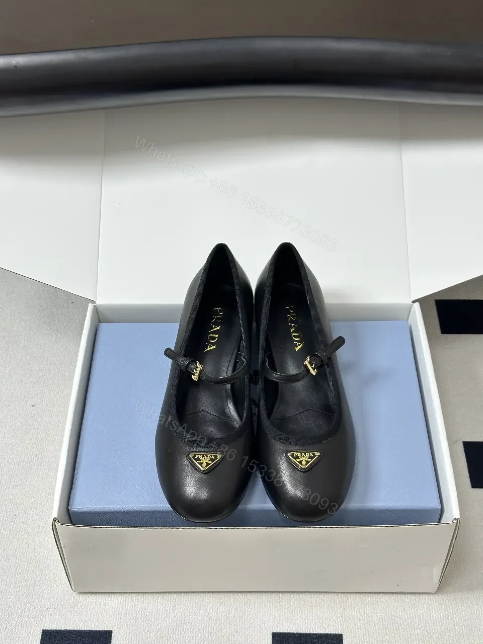 View 2 of Black Leather Mary Jane Heels with Logo Charm, Prada Style