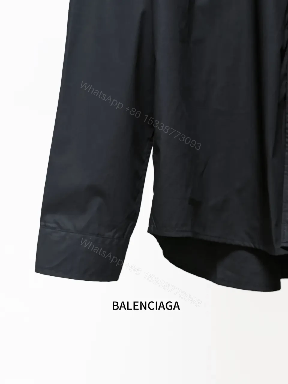 View 2 of Structured Minimalist Button-Front Shirt with Subtle Crest, Black
