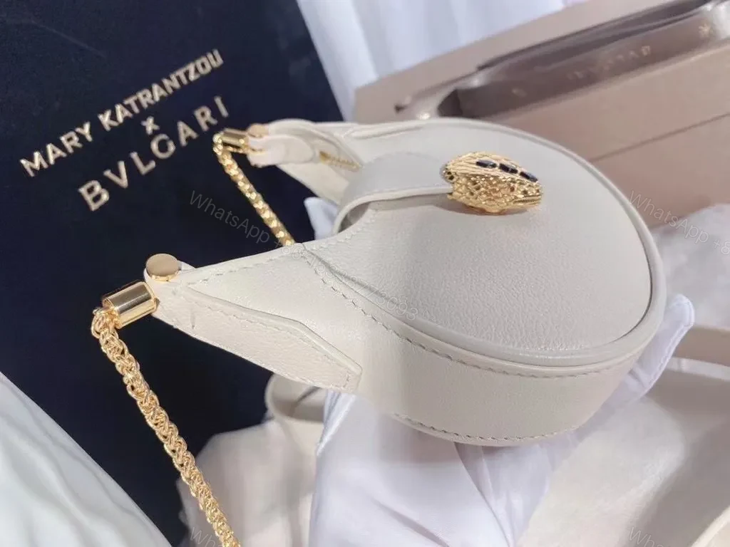 View 4 of Ivory Crescent Mini Bag â€” Day-to-Night Luxury, Sculpted Leather Bag