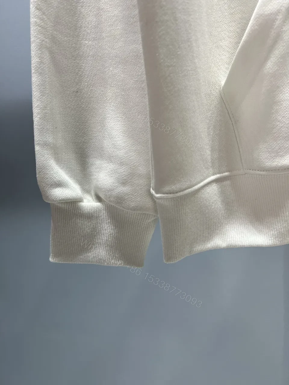 View 7 of White Hoodie with Bold Crest Graphic—Premium Comfort Streetwear