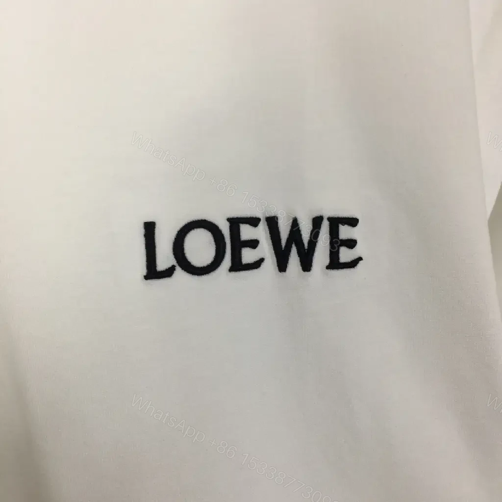 View 7 of Minimalist White Tee with Signature Accents—Premium Cotton-jersey Tee