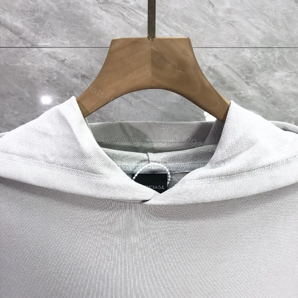 View 6 of Minimalist Sporty Hoodie with Striped Details in Knit Comfort