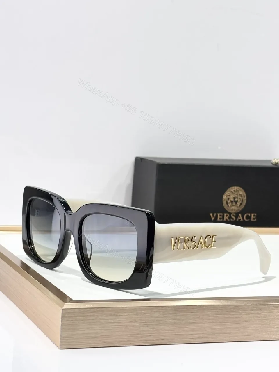 View 2 of Bold Black Statement Sunglasses with Logo-Injected Glamour