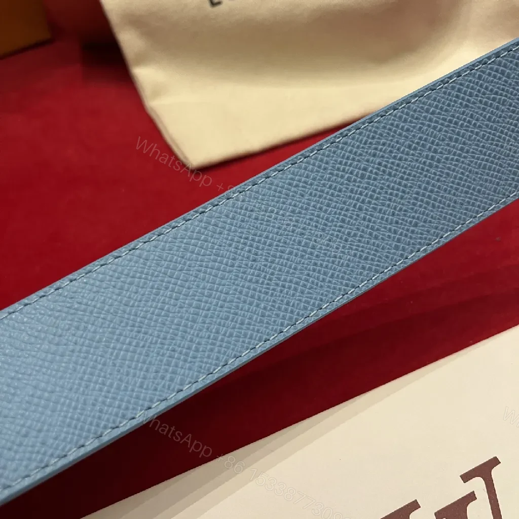 View 9 of Soft-Blue Monogram Belt: Textured Leather, Modern Silhouette, Everyday Luxury