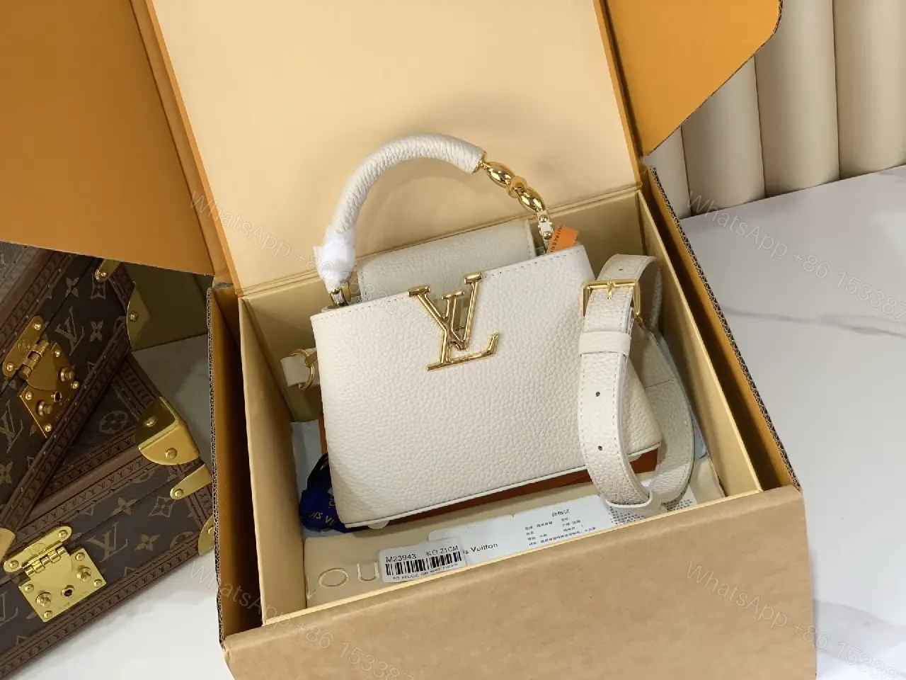 View 10 of Chic Textured Leather Mini Bag with Gold Emblem