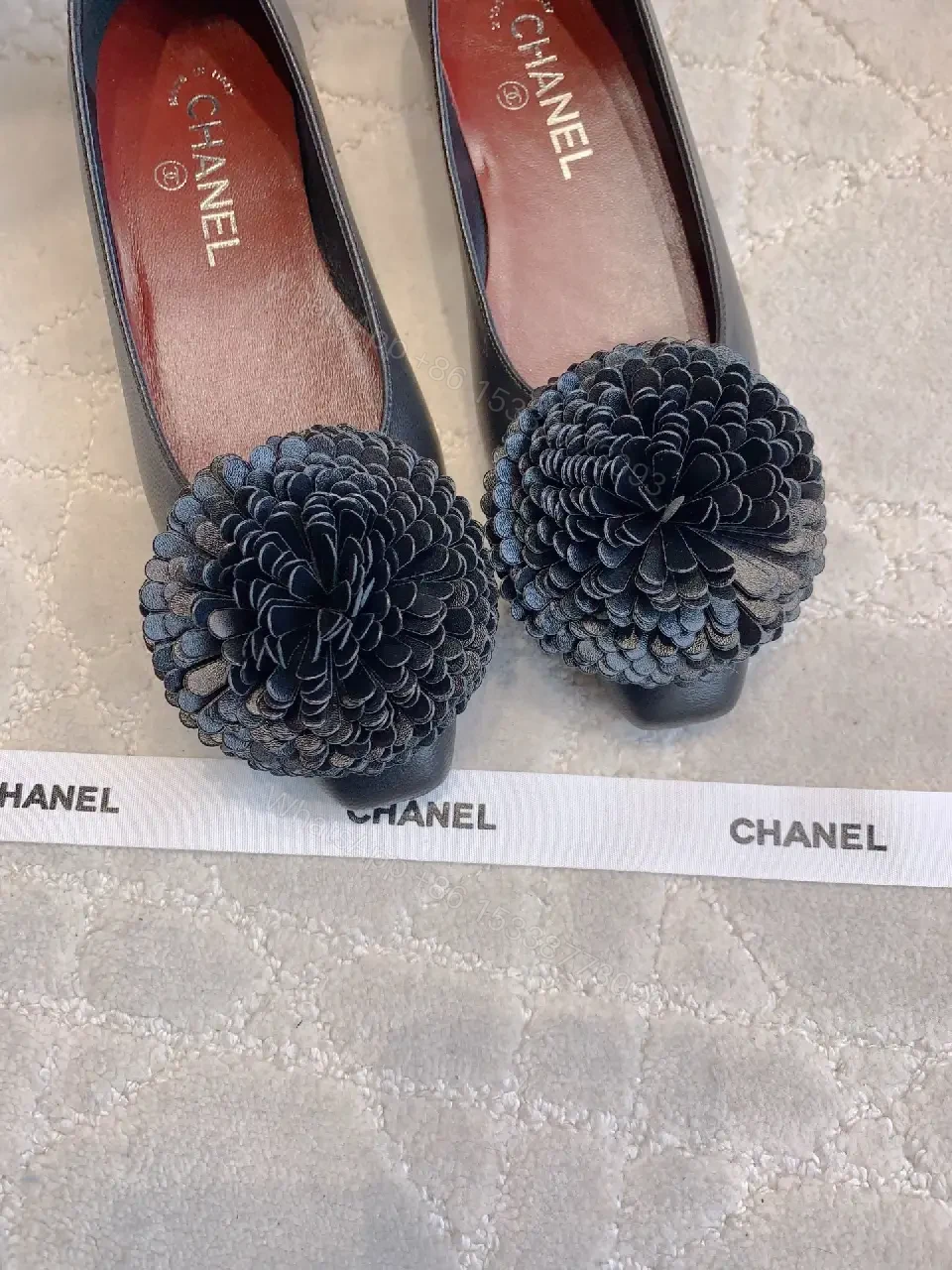 View 8 of Chic Black Pointed Flats with Floral Pom-Pom Detail