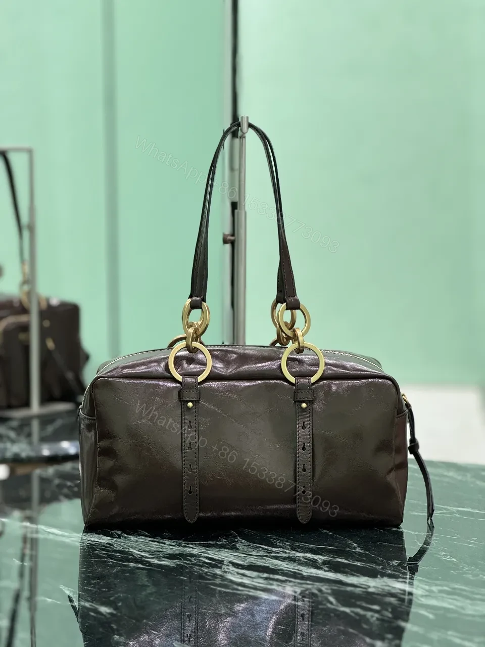 View 3 of Chic Black Leather Handbag with Gold Hardware & Structure