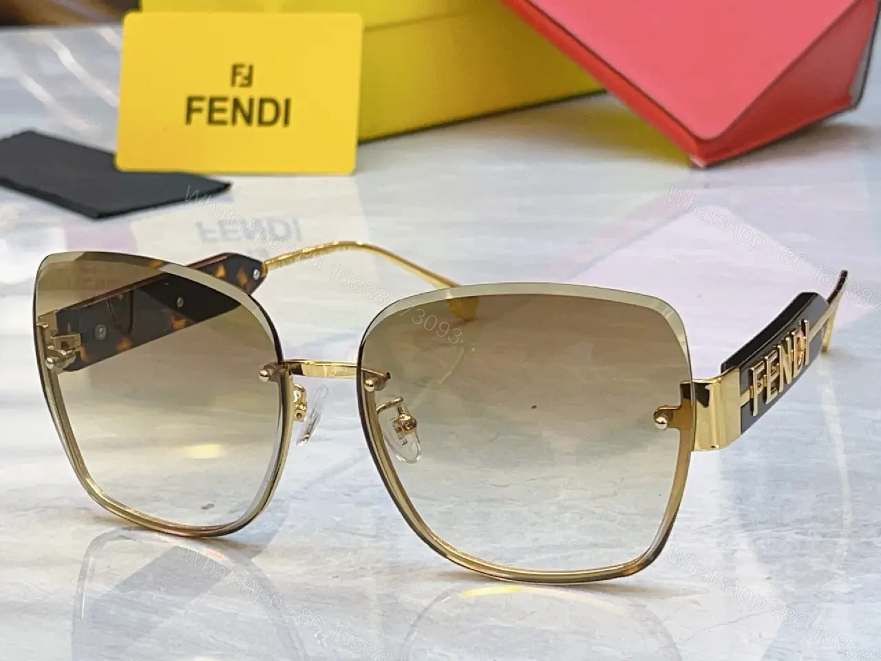View 7 of Gold Frame Pink Gradient Sunglasses with FENDI Logo