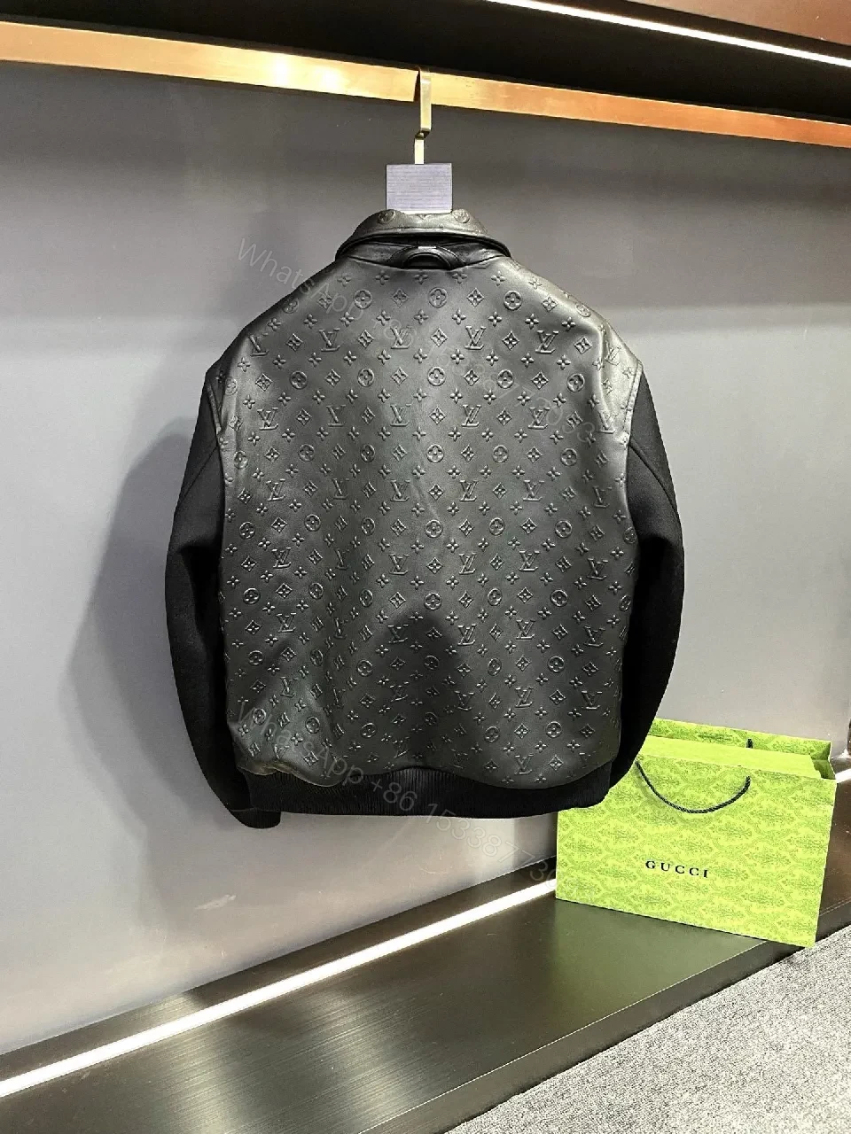 View 3 of Monochrome Leather-Embossed Varsity Jacket: Luxe Texture