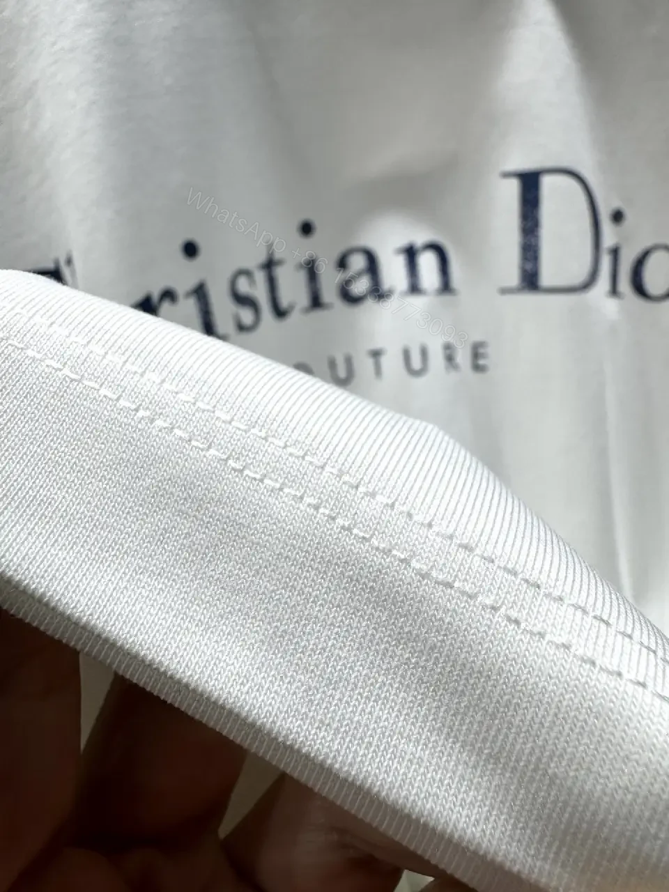 View 5 of White Cotton Crewneck Tee - Subtle Designer Crest, Everyday Luxury