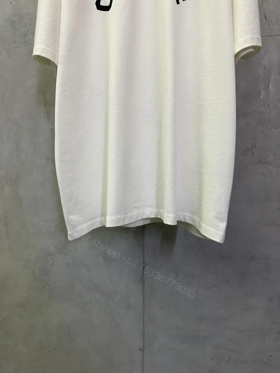 View 3 of Oversized White Cotton Tee with Bold CELINE Arch Graphic