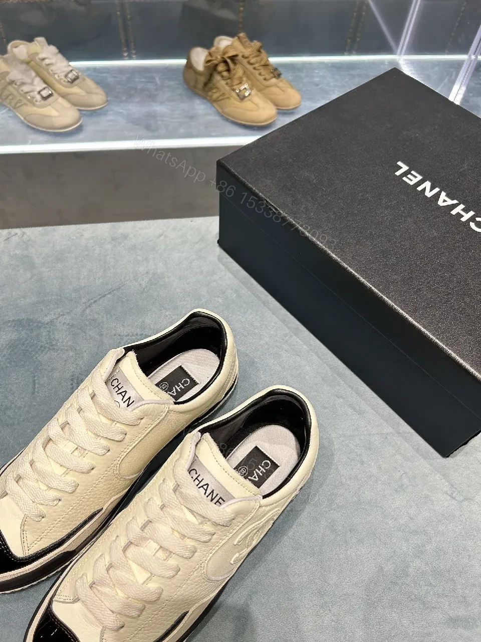 View 6 of Cream Leather Sneaker + Subtle Chanel-Inspired Detail + High-Top Comfort + Timeless Glossy Toe + Sneaker