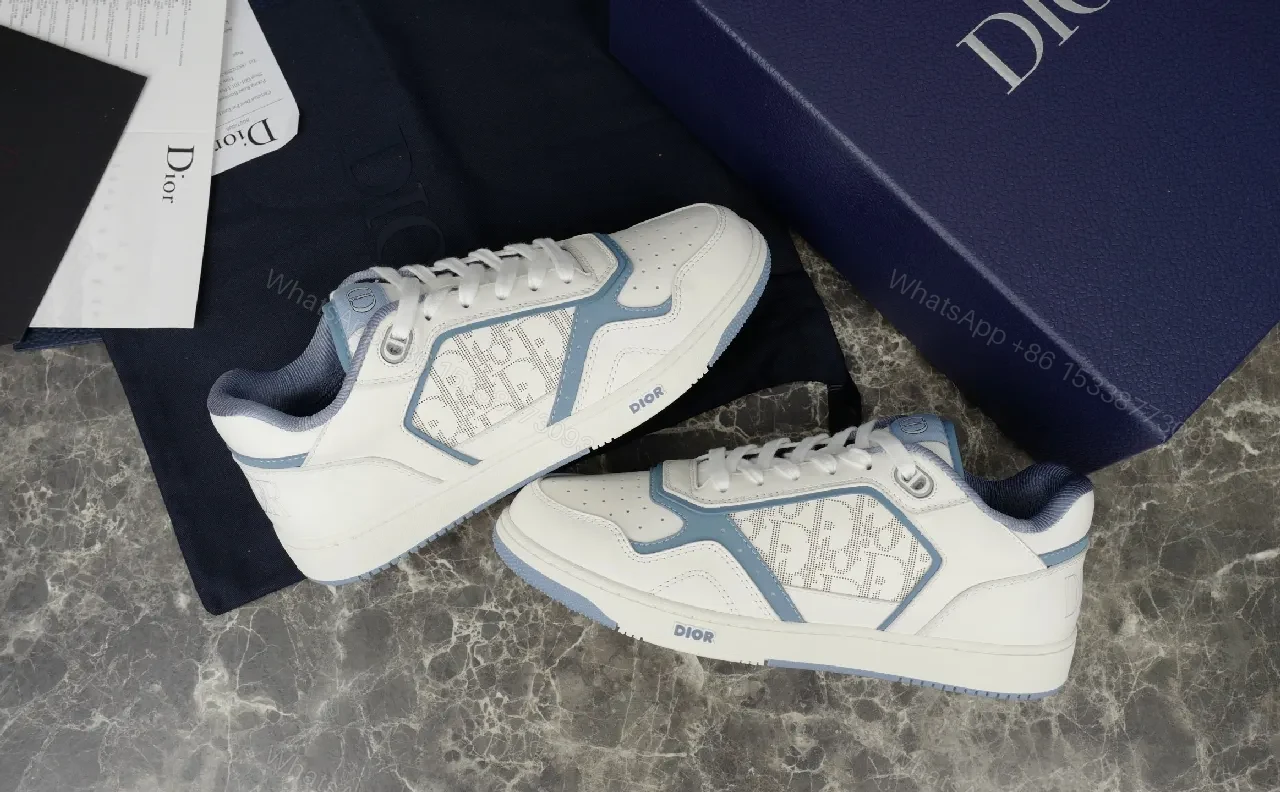 View 9 of Soft-White Leather Sneaker with Blue Accents and Signature Texture