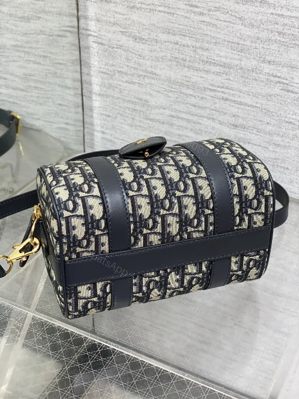 View 5 of Structured Luxe Navy Leather Mini Duffle Bag with Monogram Charm