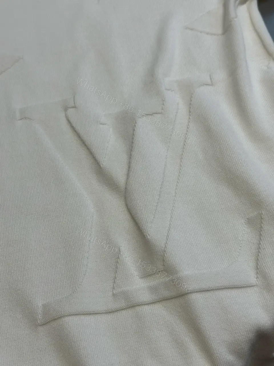 View 3 of Off-White Cream Oversized Tee with Embossed Logo Pattern