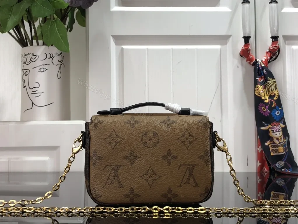 View 2 of Gold-Coated LV Monogram Crossbody Bag - Compact Luxury