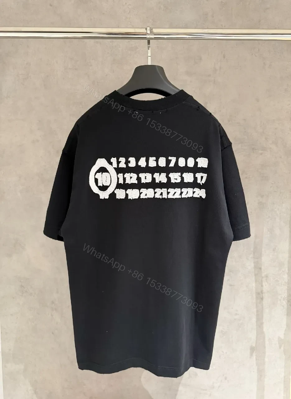 View 9 of Oversized Black Tee with Subtle Dot Logo — Luxe Everyday Wear