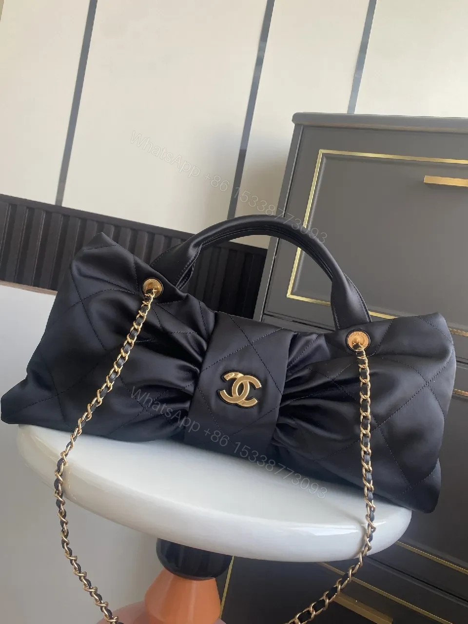 View 9 of Quilted Black Bag with Gold Emblem - Luxury Everyday Style