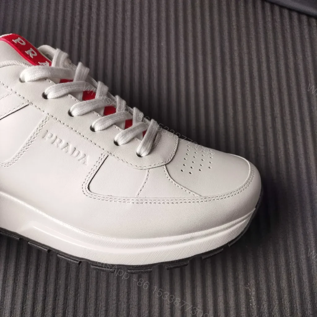View 9 of Minimalist White Leather Trainers with Red Accent - Modern Comfort Lux