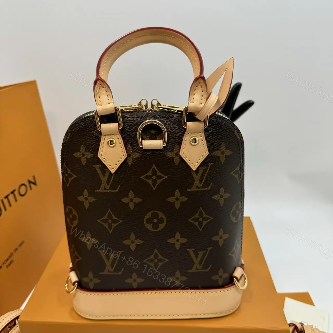 View 5 of Louis Vuitton Alma backpack in the signature brown monogram canvas