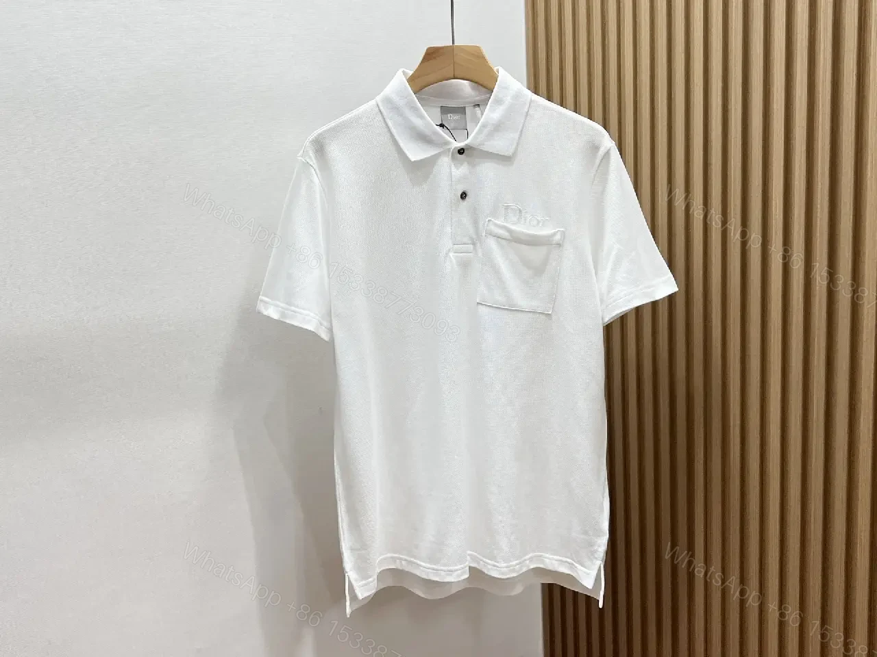 View 2 of Minimalist White Cotton Polo with Subtle Detailing