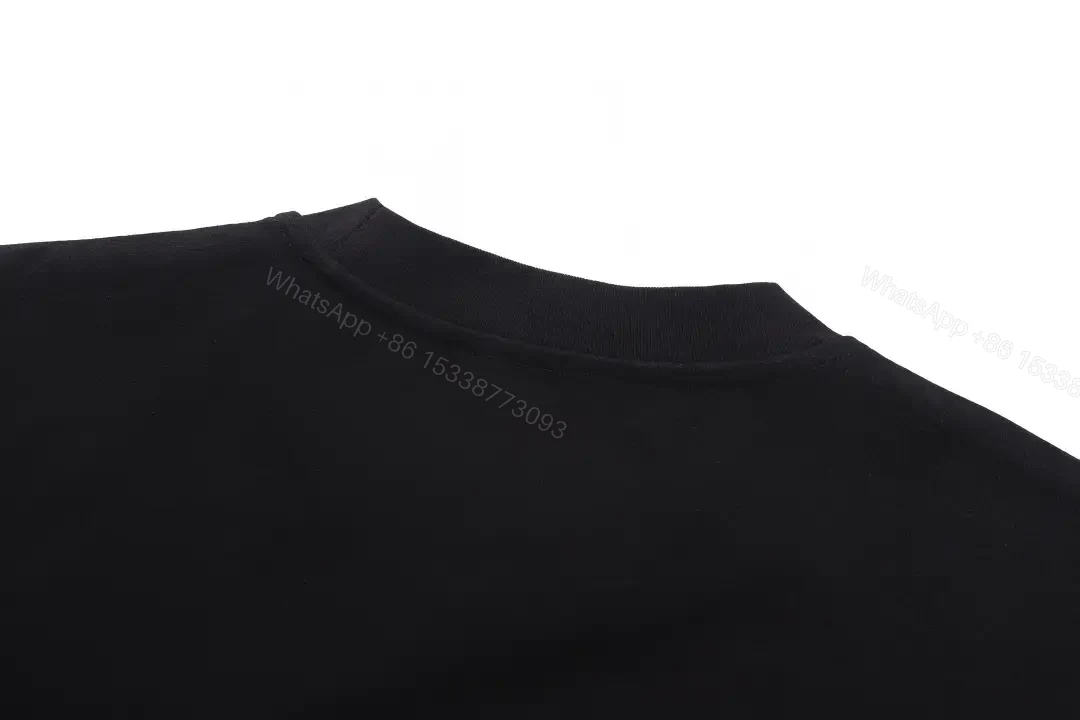 View 2 of Black Cotton Logo Tee: Subtle Crest, Everyday Luxe Top