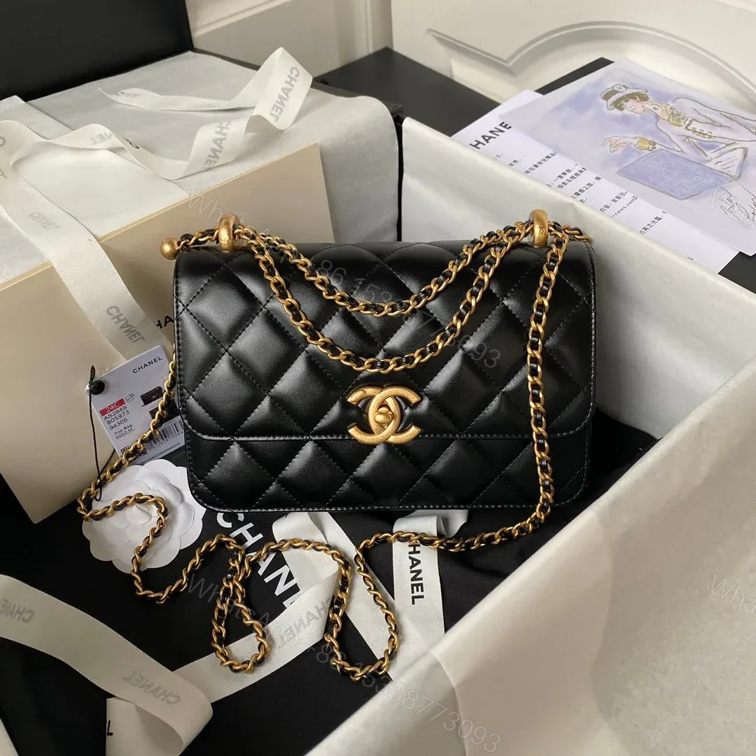 CHANEL FLAP BAG 22 IN BLACK CALFSKIN WITH DOUBLE GOLD BALL — view 1