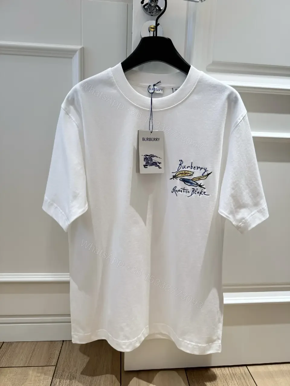 View 7 of White Cotton Oversized T-Shirt with Burberry Graphic Front