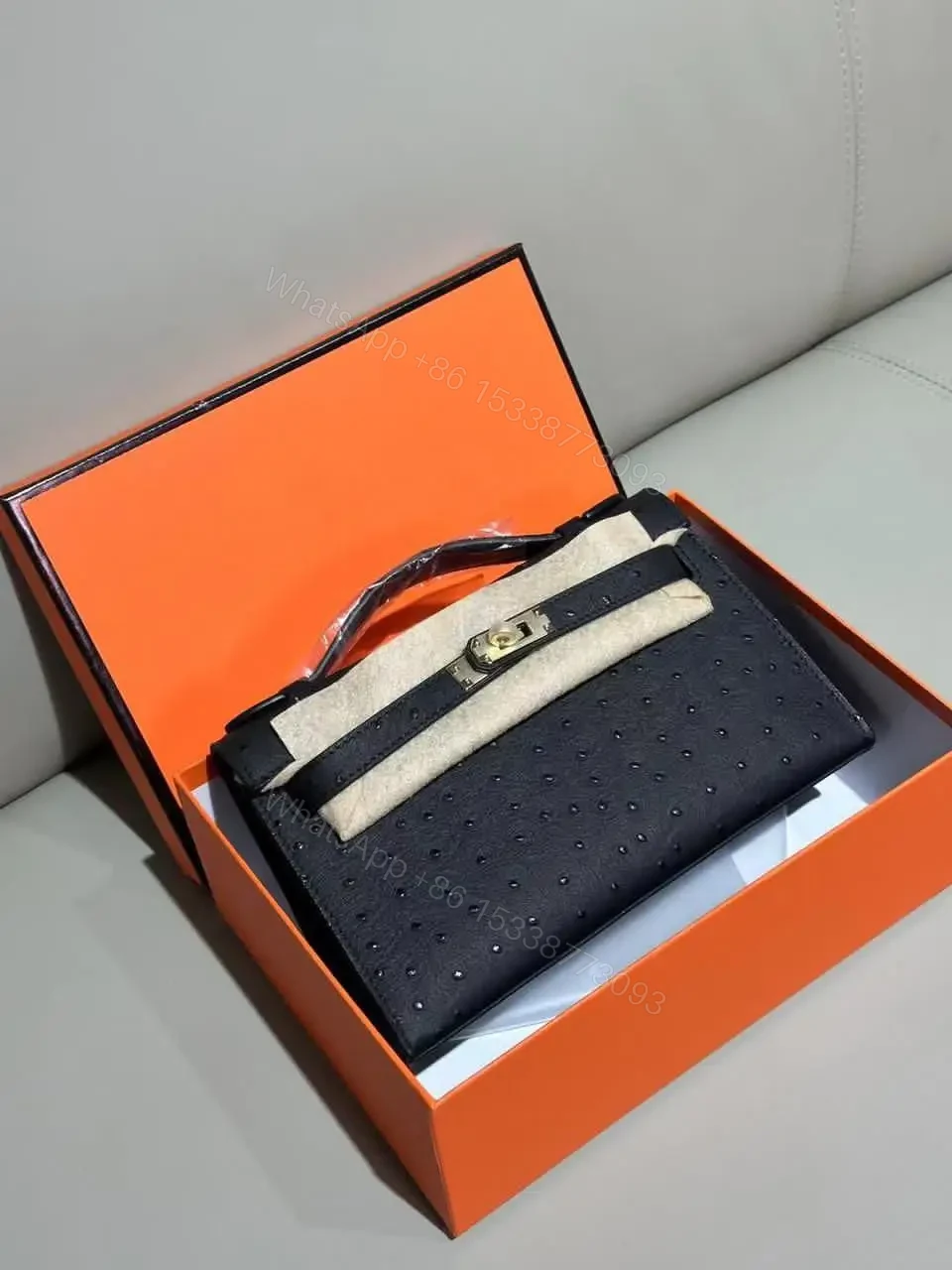 Design Kelly Pochette Noir (Black) Ostrich Gold Hardware GHW – Dubai Fashion LUX — view 1