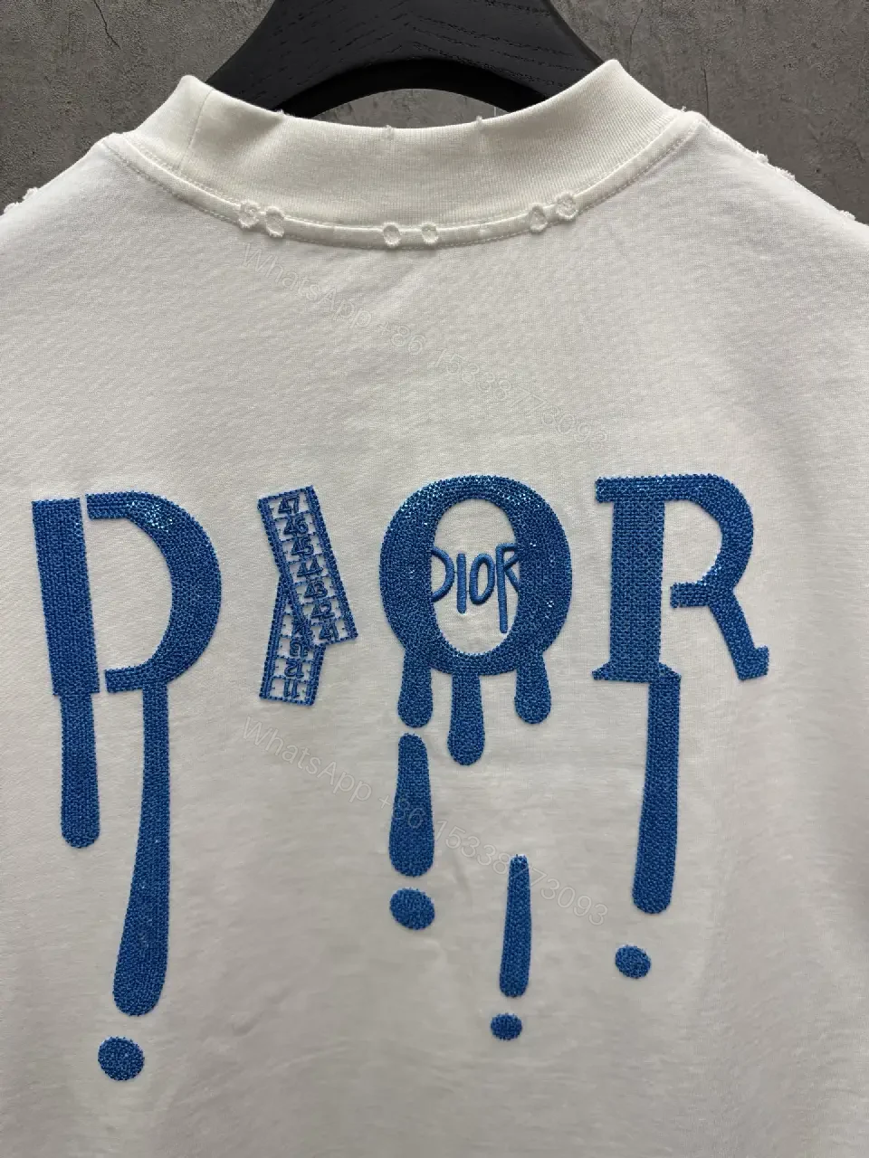 View 10 of Minimalist White Tee with Blue Embroidered Logo, Premium Cotton