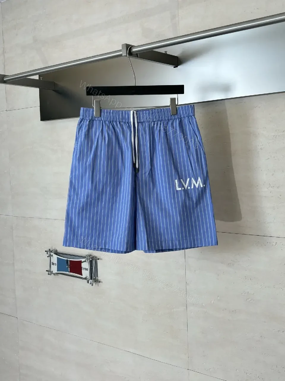 View 8 of Blue Striped Lightweight Drawstring Shorts - Subtle Embossed Logo Luxury